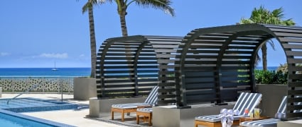 Cabanas with shaded coverings at the pool at Amrit Ocean Resort.