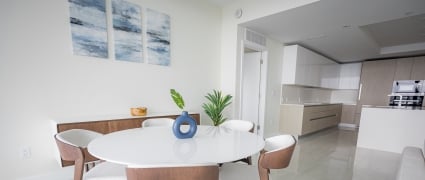 The dining space and kitchen in an intracoastal View Wellness Residence at the Amrit Ocean Resort