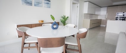 The dining space and kitchen in an intracoastal View Wellness Residence at the Amrit Ocean Resort
