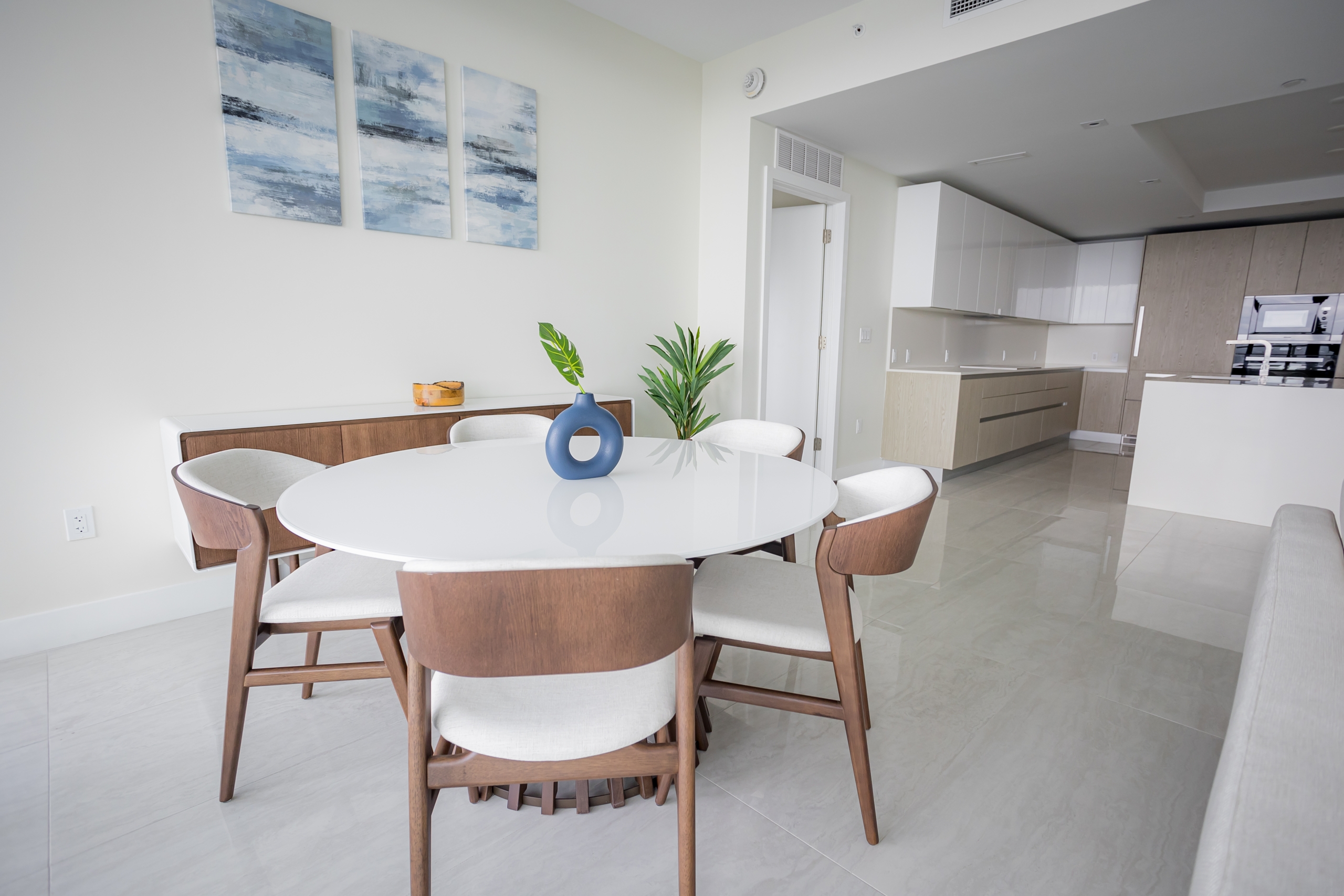 The dining space and kitchen in an intracoastal View Wellness Residence at the Amrit Ocean Resort