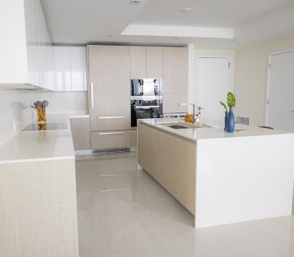 The kitchen with a centre island in an intracoastal View Wellness Residence at the Amrit Ocean Resort