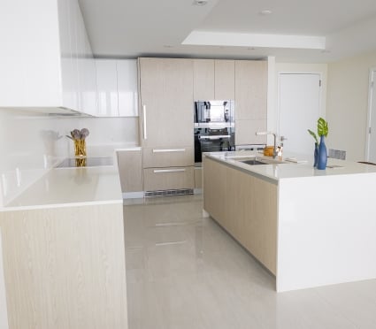 The kitchen with a centre island in an intracoastal View Wellness Residence at the Amrit Ocean Resort