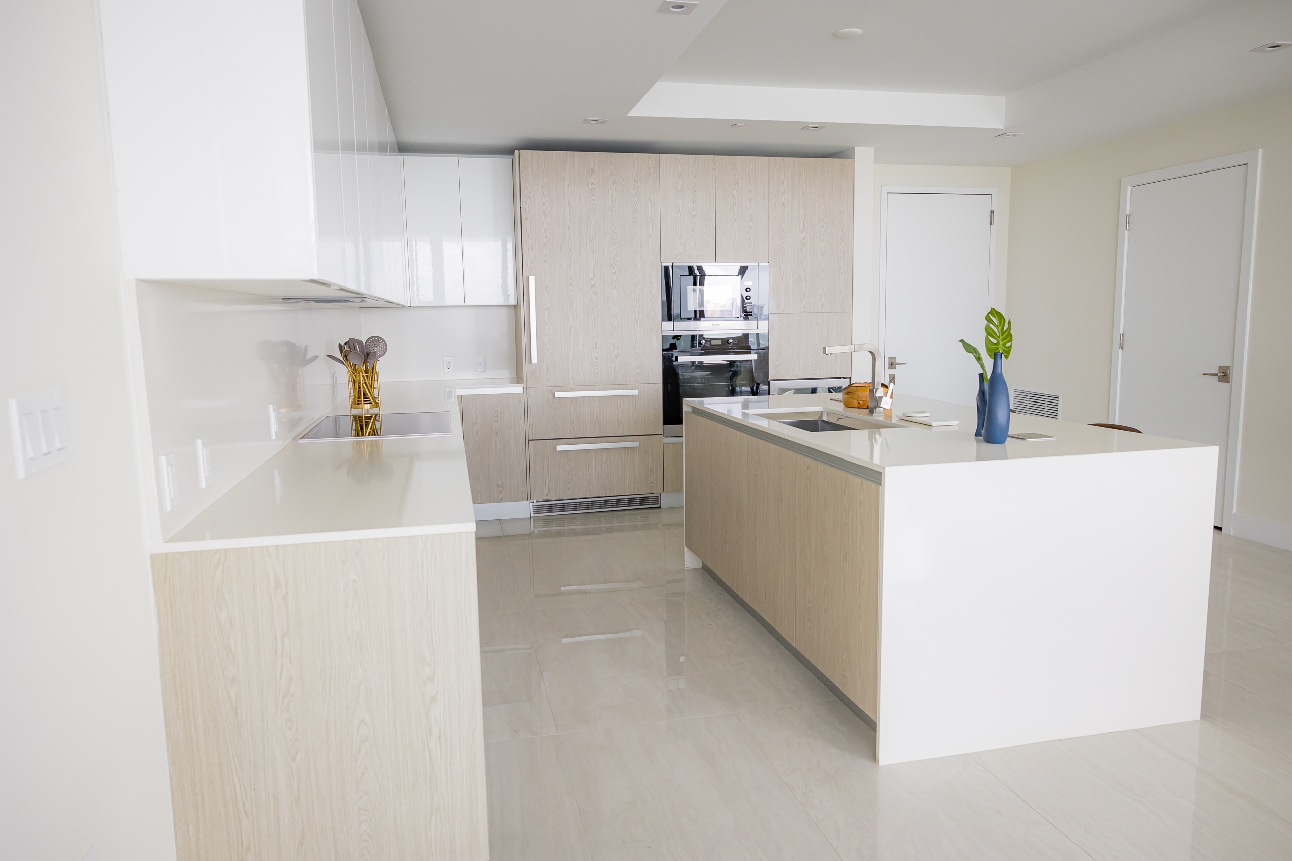 The kitchen with a centre island in an intracoastal View Wellness Residence at the Amrit Ocean Resort