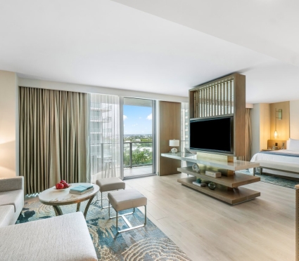 Living space and bedroom space of a junior suite king at Amrit Ocean Resort