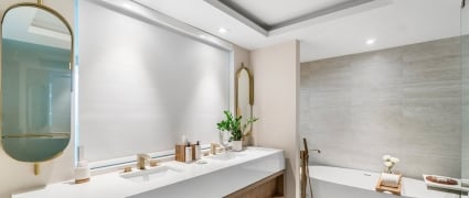Large vanity and soaker tub in a junior suite king at Amrit Ocean Resort