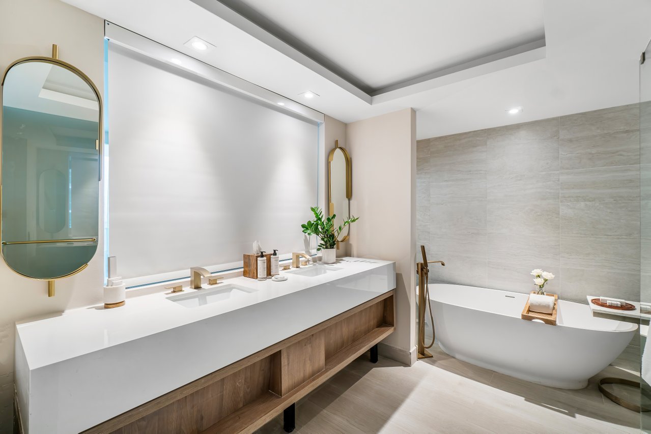 Large vanity and soaker tub in a junior suite king at Amrit Ocean Resort