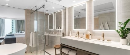 The washroom with a soaker tub, shower and vanity in an ocean view two queens room at the Amrit Ocean Resort