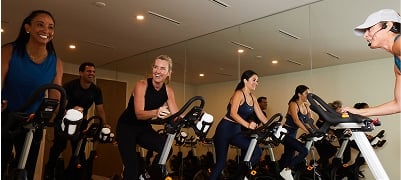 People attending a spin class at the Amrit Ocean Resort