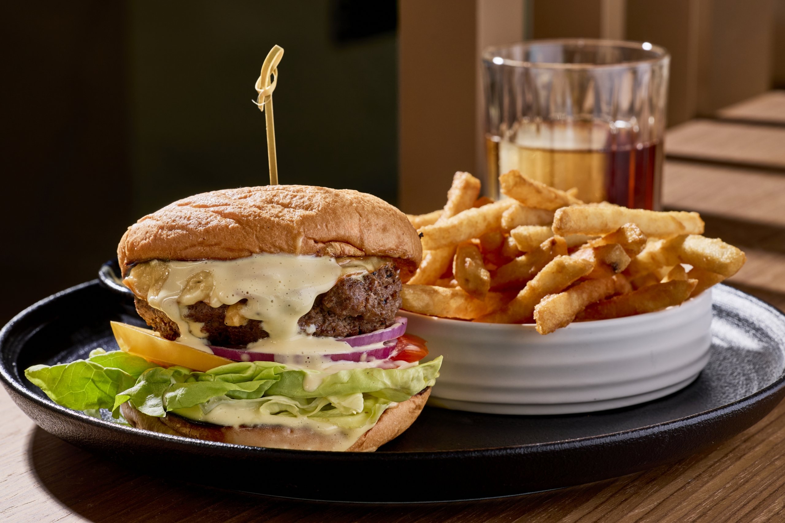 A juicy burger, fries and a cocktail at LALA